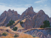 Ancient Hunters Overlook Painting by Brenda Howell showing unusual rocky formations in landscape with desert grassland at Badlands National Park in South Dakota.